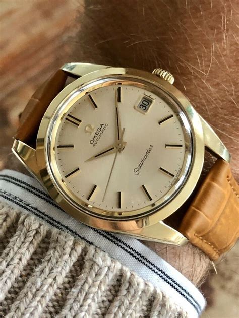 reloj omega plateado de estensiblr de piel|relojes de oro.